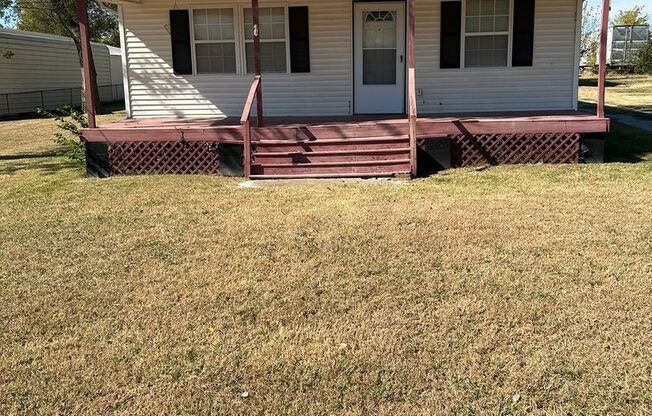 Nice 2 or 3 bedroom with covered front porch.