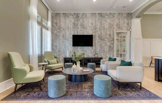a living room with couches and chairs and a television at Madison on the Meadow, Stafford, Texas