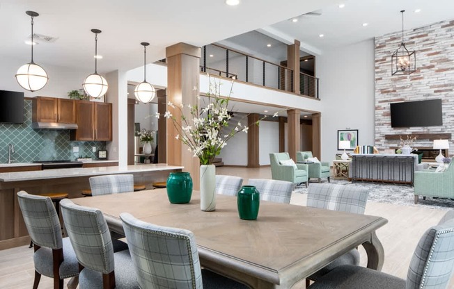 A modern dining room with a large table and chairs.