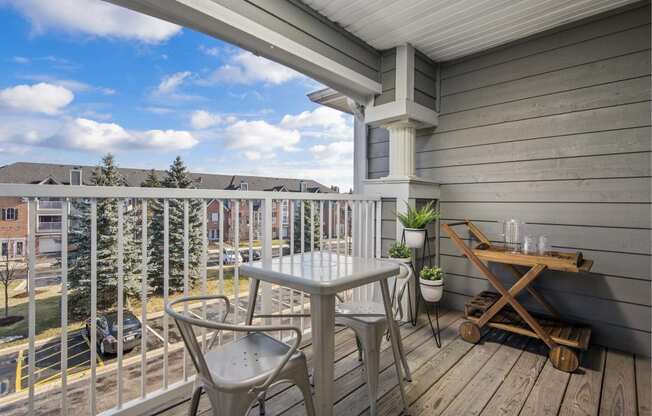 Outdoor patio with a seating area and parking lot view