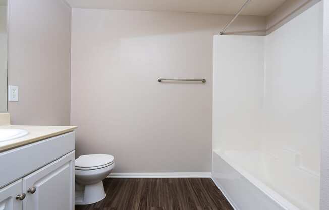 a bathroom with a toilet sink and bathtub