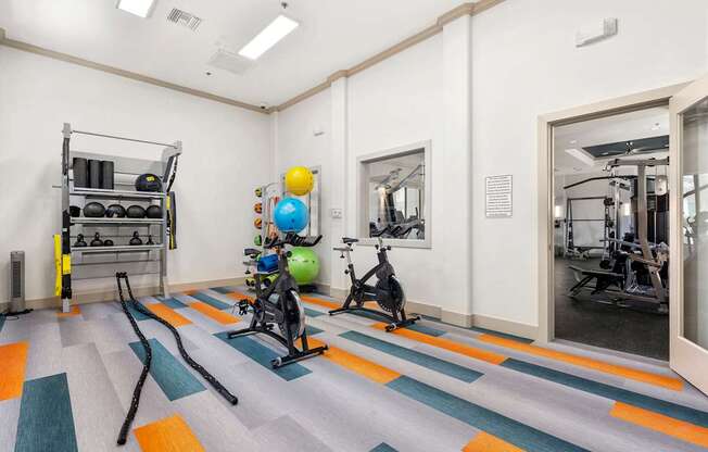 A gym with a variety of exercise equipment.