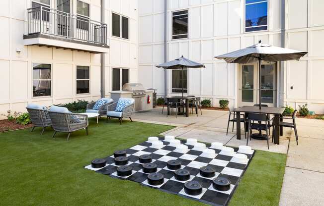 a chess board in the yard of an apartment building