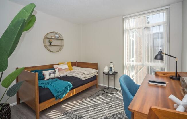 Spacious second bedroom with floor to ceiling window