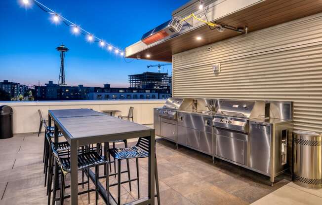 a kitchen with stainless steel appliances and a table