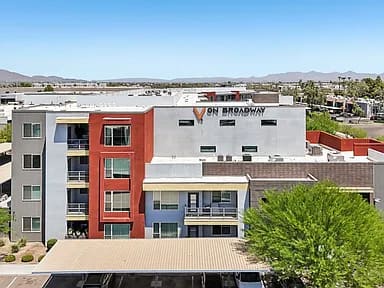 A building with the sign 9N Broadway on it.
