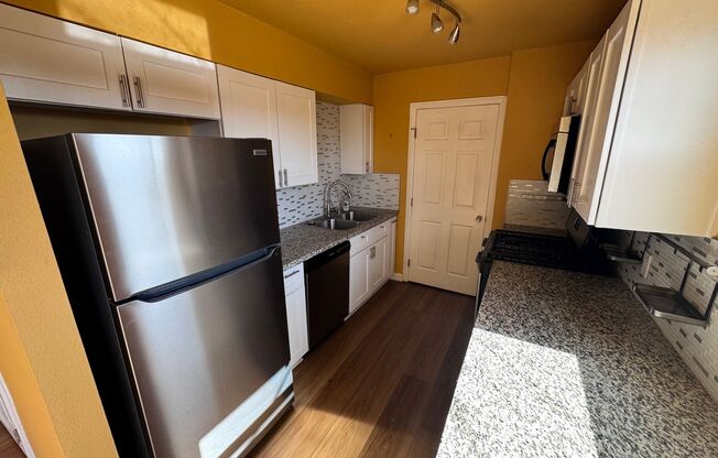 Colorful bungalow style home with plenty of yard.