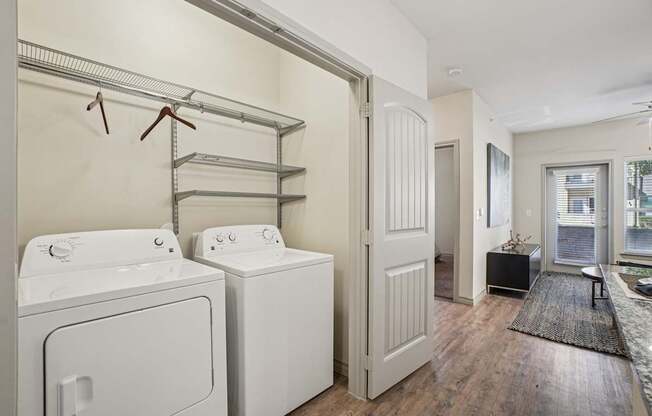 A laundry room with a washer and dryer.