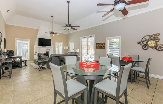 a living room filled with furniture and a table