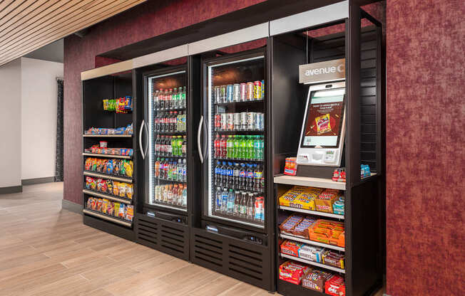 A vending machine with a variety of drinks and snacks.