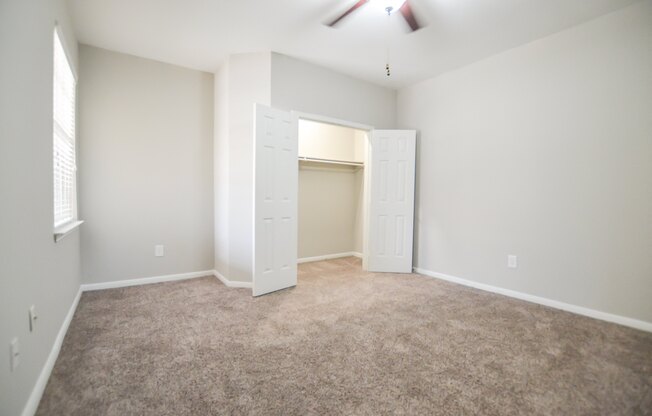 Spacious open concept bedroom with natural light and large closet at The Legends at Eagle Mountain Lake, Fort Worth, TX