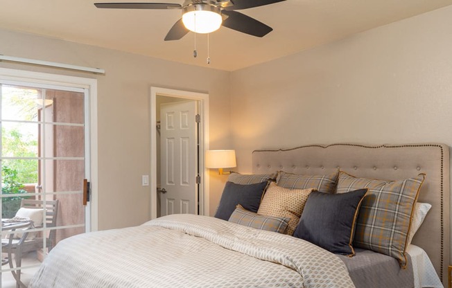 La reserve bedroom with ceiling fan and nice natural lighting