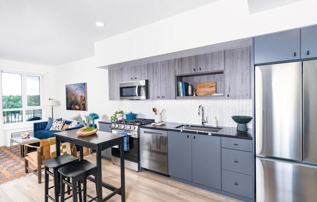 Gourmet kitchens with quartz countertops, custom cabinetry with soft close, and under-cabinet lighting.