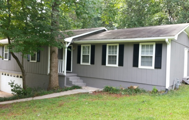 Natural Setting 5 bedroom 2 bath with finished basement home in Winston, GA