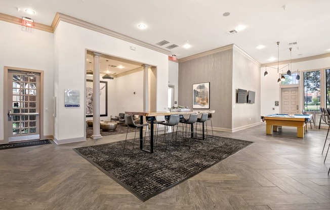 Welcoming space in the resident clubhouse with dining room table and pool table at Mission Gate, Plano, 75024