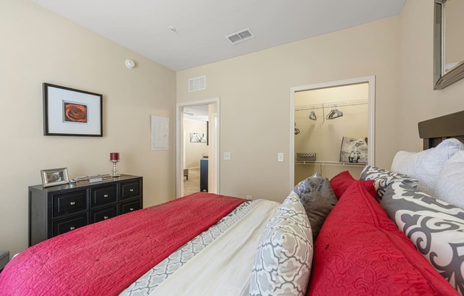 a bedroom with a bed and a closet