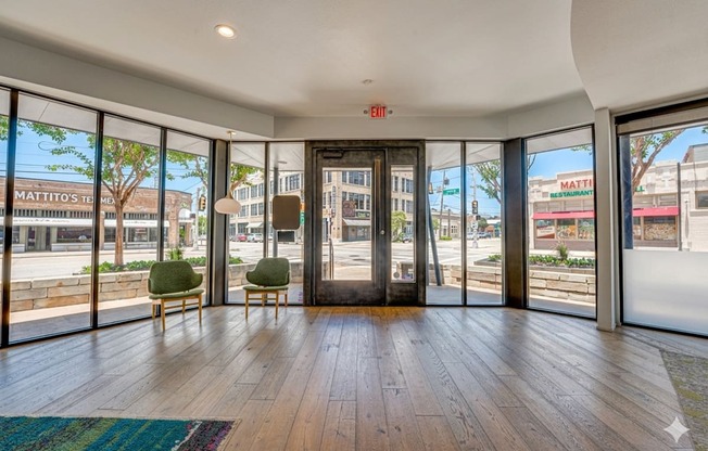 Modern lobby entrance with floor to ceiling windows at Vue Live Oak Apartments, Dallas, Texas