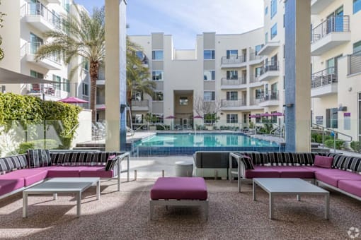 a view of the pool at vivo city condominiums pool and lounge area