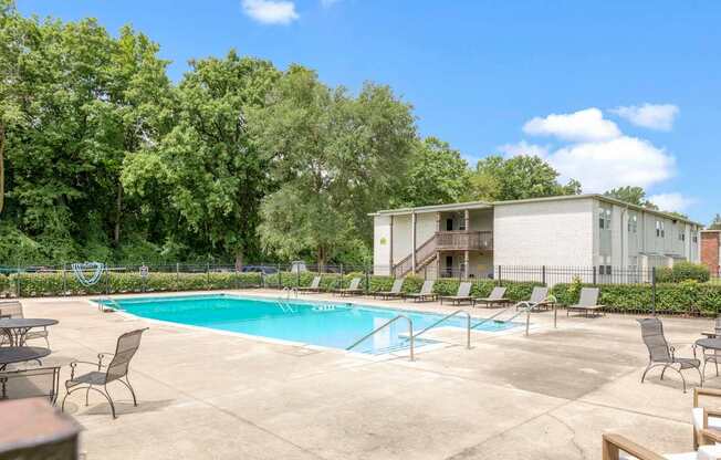 our apartments have a resort style pool and lounge chairs