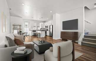 a living room with a couch and a table  at Aero Luxury Townhomes in Layton, Utah