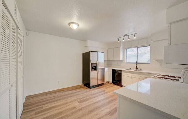 Welcome to this beautifully remodeled ground-floor residence, ideally situated near Charleston and Rainbow.