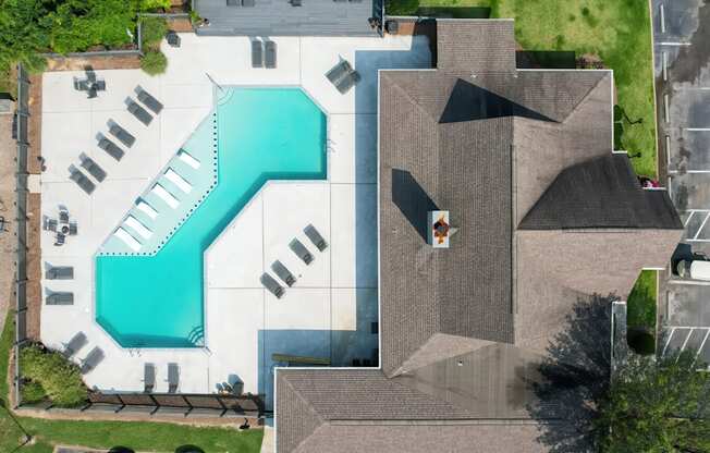 arial view of a house with a swimming pool on the roof