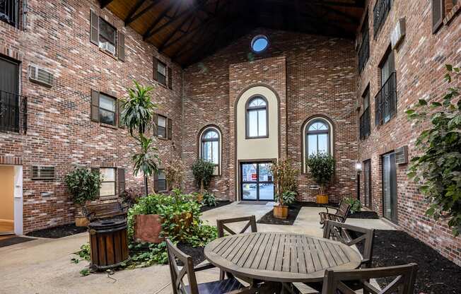 Kent apartment courtyard interior with lunch table.