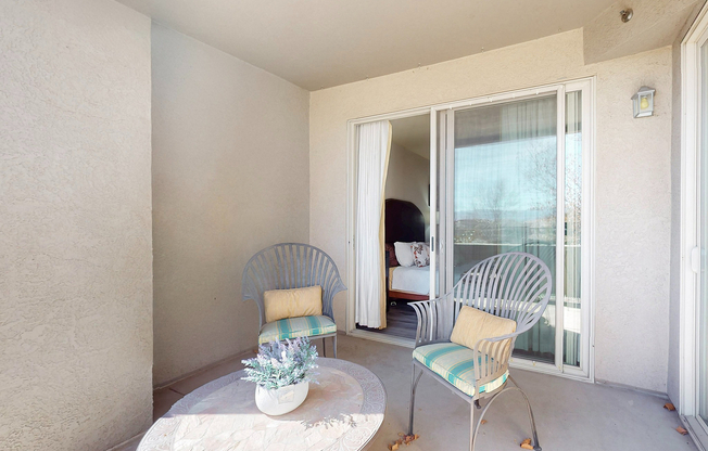 Relax and unwind on this charming balcony, offering a serene outdoor escape.