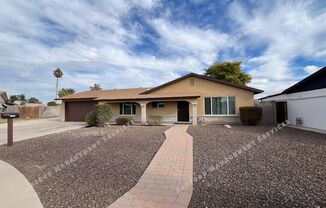 BEAUTIFULLY UPDATED 3 BEDROOM HOME WITH HUGE BACKYARD, RV GATE & ARIZONA ROOM IN GLENDALE!