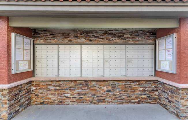 A brick wall with a white board on it at Urban WalkApartments on 6th Avenue, Phoenix, AZ