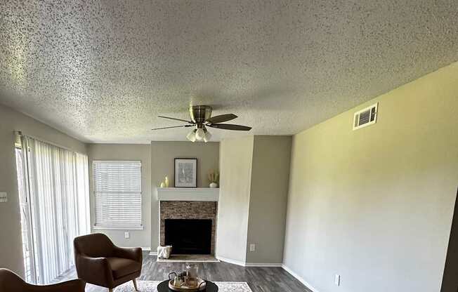 A hallway with a wooden wall and a white chair.