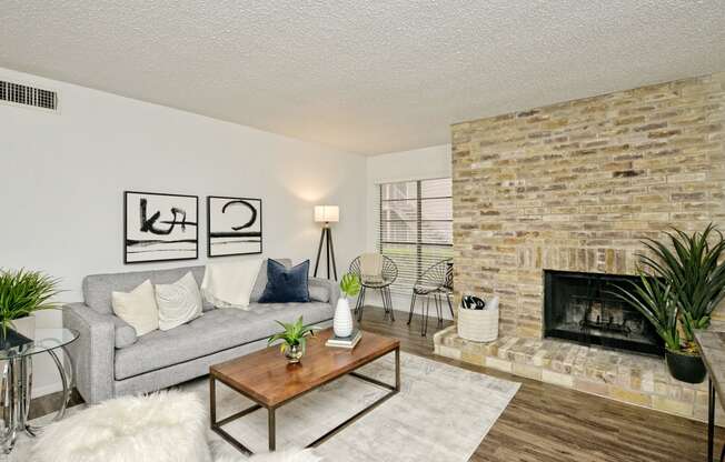 a living room with a couch and a fireplace