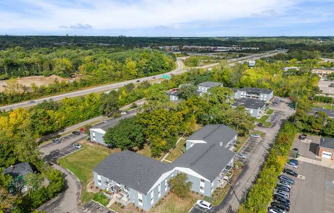 A large building with a parking lot in front of it.