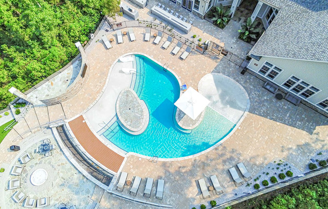 Beach-entry saltwater pool with sundeck, fire pit, TV and outdoor lounge