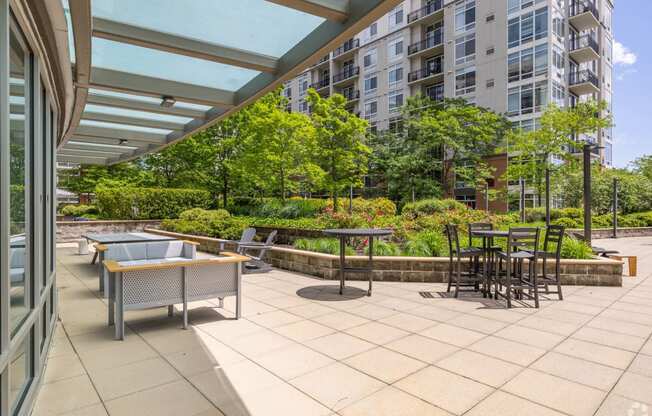 a patio with a table and chairs on a patio