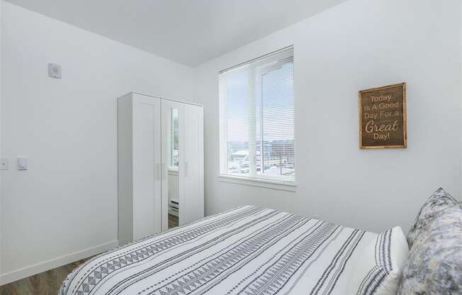 a bedroom with a large bed next to a window at Jefferson Yards, Tacoma, 98402