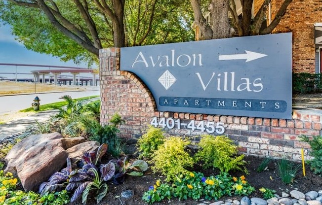 a sign that says avalon villages apartments