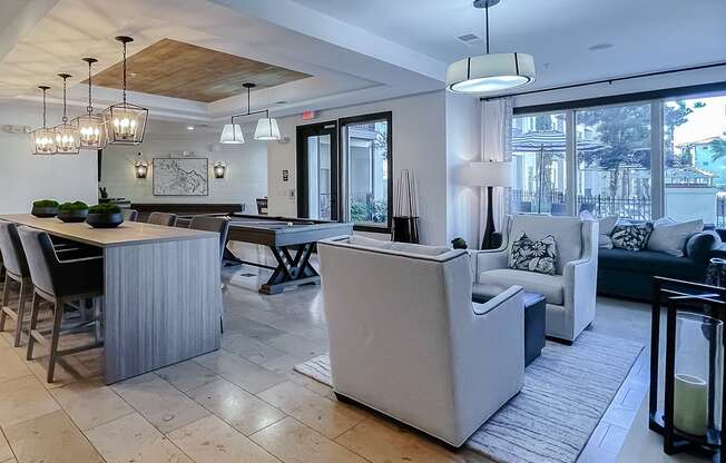 Resident lounge seating areas and large windows  at Two Addison Place Apartments , Georgia