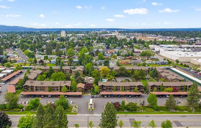 an aerial view of a city with lots of buildings and trees at Lincoln Village Apartments, Washington