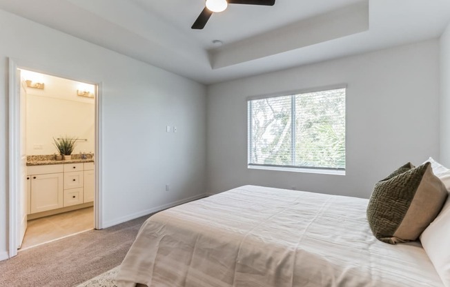 Boatman Hammock Townhomes in Lake Worth, FL photo of an empty bedroom with a large bed and a window