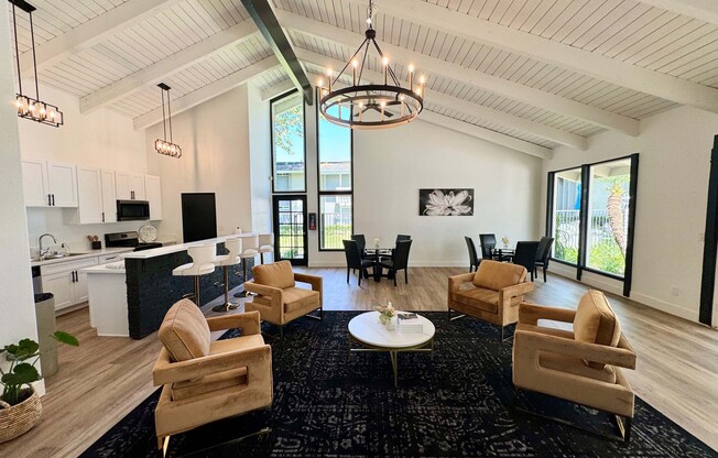 a living room filled with furniture and a large window