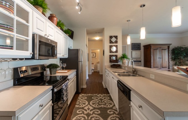 This is a photo of the kitchen in the 2 bedroom, 2 bath Islander floor plan at Nantucket Apartments in Loveland, OH.