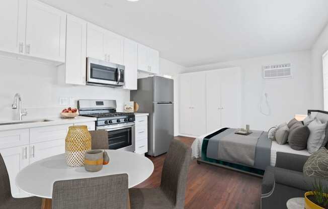 a kitchen and dining area in a 555 waverly unit