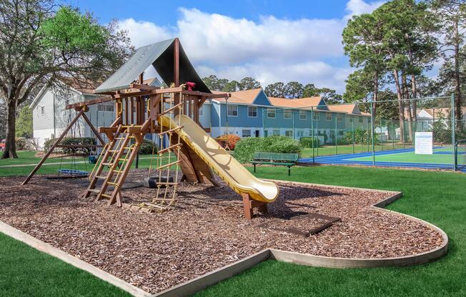 a group of lawn chairs sitting on top of a grass covered field
