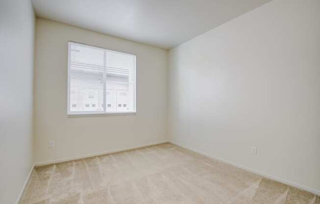 a bedroom with white walls and a window  at Seville at Gale Ranch, San Ramon, CA