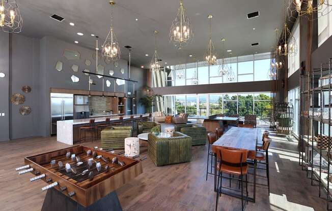 A modern dining room with a large wooden table and chairs.