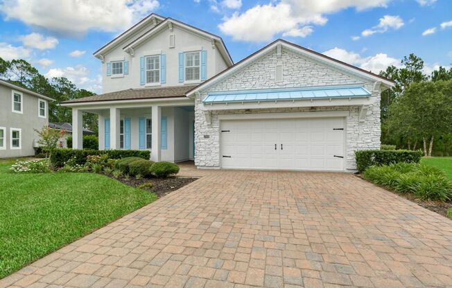Welcome Home to this beautifully designed home located in the prestigious gated community of Coastal Oaks in Ponte Vedra