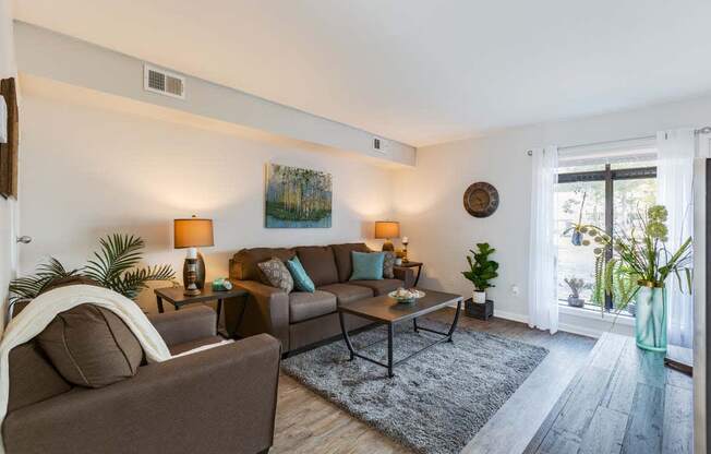 a living room with a couch and a sliding glass door