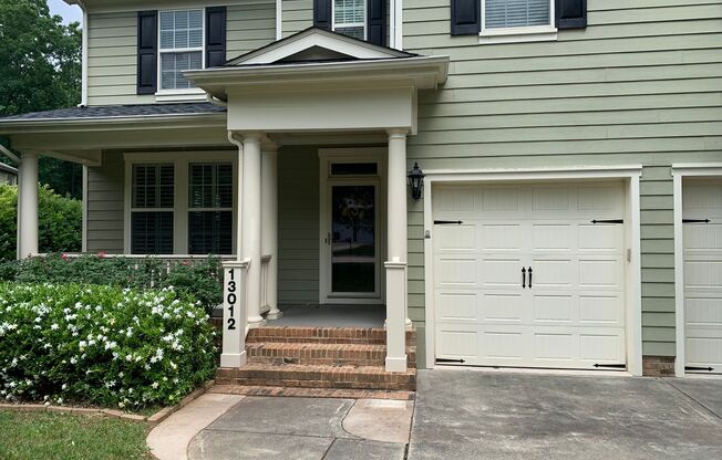 NW RALEIGH TWO STORY BRICK HOME IN ESTABLISHED NEIGHBORHOOD WITH TWO CAR GARAGE