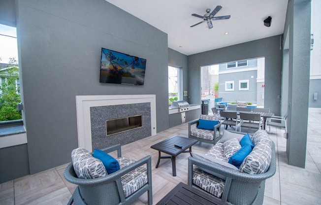 a living room with couches and chairs and a fireplace